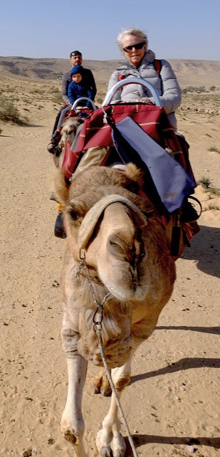 Sue riding a camel like a pro